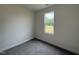 Bedroom featuring neutral paint, plush carpeting and a view to the outdoors through the large window at 274 Longbow Dr, Middlesex, NC 27557