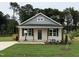 Charming single-story home with a welcoming front porch and well-manicured lawn at 274 Longbow Dr, Middlesex, NC 27557