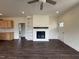 Cozy living room with a fireplace, built-in shelving, and hardwood floors at 274 Longbow Dr, Middlesex, NC 27557