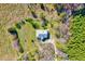 This aerial view highlights the property's wooded lot and tranquil surroundings with natural beauty at 290 Collie Rd, Castalia, NC 27816