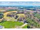 Panoramic view showcasing the surrounding land and highlighting lush fields, forests, and neighborhood homes at 290 Collie Rd, Castalia, NC 27816