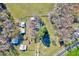This aerial view shows a sprawling rural property with several outbuildings and mature trees at 290 Collie Rd, Castalia, NC 27816