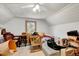 Unfinished attic space, ideal for storage, with ceiling fan, window, and plank ceiling at 290 Collie Rd, Castalia, NC 27816
