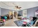 Cozy bedroom featuring a ceiling fan, a rug, and natural light at 290 Collie Rd, Castalia, NC 27816