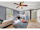 View of bedroom with ceiling fan, a window, an area rug, bed, and decorations at 290 Collie Rd, Castalia, NC 27816