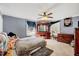 Spacious bedroom with ceiling fan, natural light, area rug and a dresser with large mirror at 290 Collie Rd, Castalia, NC 27816