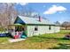 A light green single-story home has a metal roof and a covered front porch at 290 Collie Rd, Castalia, NC 27816