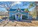 Charming two-story home featuring a covered front porch and a well-maintained yard at 290 Collie Rd, Castalia, NC 27816
