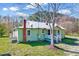 Cozy covered porch, freshly painted exterior, with attached porch on the side at 290 Collie Rd, Castalia, NC 27816