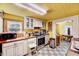 Well-equipped kitchen with white cabinets, tiled floors, stainless steel appliances, and plenty of counter space at 290 Collie Rd, Castalia, NC 27816