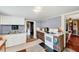 This well-lit kitchen features neutral paint, linoleum flooring, and an abundance of natural light at 290 Collie Rd, Castalia, NC 27816