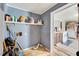 Picture of laundry room with an open view into the kitchen area, with shelving at 290 Collie Rd, Castalia, NC 27816