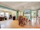 Inviting living room with hardwood floors and open floor plan to an office and view of another room at 290 Collie Rd, Castalia, NC 27816