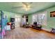 Bright living room with hardwood floors, a ceiling fan, and large windows offering lots of natural light at 290 Collie Rd, Castalia, NC 27816