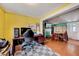Comfortable office space featuring laminate floors, a work desk, and easy access to the living room at 290 Collie Rd, Castalia, NC 27816