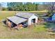 Rustic outbuilding featuring covered storage, perfect for storing equipment or using as a workshop space at 290 Collie Rd, Castalia, NC 27816