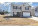 Charming two-story home with stone accents, attached two-car garage, and well-maintained lawn at 2902 Cullens Dr, Graham, NC 27253