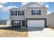 Charming two-story home with stone accents, attached two-car garage, and well-maintained lawn at 2902 Cullens Dr, Graham, NC 27253