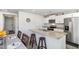 Modern kitchen with stainless steel appliances, granite countertops, and white cabinets at 2902 Cullens Dr, Graham, NC 27253