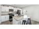 Modern kitchen with stainless steel appliances, granite countertops, and white cabinets at 2902 Cullens Dr, Graham, NC 27253