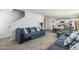 Bright living room open to dining and kitchen with hardwood floors and comfortable seating at 2902 Cullens Dr, Graham, NC 27253