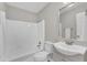 Bathroom features white sink, toilet, and bathtub with shower at 2914 Old Stage N Rd, Coats, NC 27521