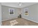 Cozy bedroom with wood-look floors and two windows for natural light at 2914 Old Stage N Rd, Coats, NC 27521
