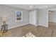 Well-lit bedroom with wood-look floors and a window view at 2914 Old Stage N Rd, Coats, NC 27521