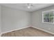 Neutral bedroom with wood flooring and a window with natural light at 2914 Old Stage N Rd, Coats, NC 27521