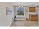 Eat-in kitchen with wood floors, natural light, and a view of the outdoors at 2914 Old Stage N Rd, Coats, NC 27521
