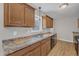 Kitchen featuring wood cabinets, stainless steel sink, and laminate countertops at 2914 Old Stage N Rd, Coats, NC 27521