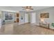 Open-concept living room leading to kitchen with light gray walls, new flooring and lots of natural light at 2914 Old Stage N Rd, Coats, NC 27521
