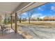 Covered front porch with furniture and a view of the yard and street at 2914 Old Stage N Rd, Coats, NC 27521