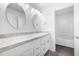 Bathroom vanity with double sinks, decorative mirrors and modern fixtures at 3105 Marshlane Way, Raleigh, NC 27610