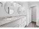 Elegant bathroom featuring double sinks, granite countertops, and modern fixtures at 3105 Marshlane Way, Raleigh, NC 27610