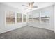 Bright bedroom featuring multiple windows, neutral carpet, and white walls at 3105 Marshlane Way, Raleigh, NC 27610
