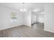 Open dining area featuring modern gray vinyl floors and ample natural light at 3105 Marshlane Way, Raleigh, NC 27610