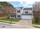 Charming two-story home featuring a well-maintained lawn and a two-car garage at 3105 Marshlane Way, Raleigh, NC 27610
