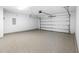 Spacious garage with epoxy flooring and an automatic door opener at 3105 Marshlane Way, Raleigh, NC 27610