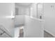 Bright hallway featuring open stairwell leading to a upper level with multiple rooms at 3105 Marshlane Way, Raleigh, NC 27610