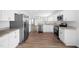 Stylish kitchen featuring stainless steel appliances, white cabinets, and an open layout perfect for entertaining at 3105 Marshlane Way, Raleigh, NC 27610