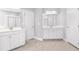Spacious bathroom with double vanities, tile flooring, and separate rooms at 3574 Johnson Grant Dr, New Hill, NC 27562