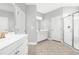 Bathroom with double vanities, tiled floor, and glass door shower at 3574 Johnson Grant Dr, New Hill, NC 27562