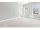Neutral bedroom with two windows providing natural light at 3574 Johnson Grant Dr, New Hill, NC 27562