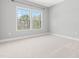 Bright bedroom featuring two large windows with natural light and neutral carpet at 3574 Johnson Grant Dr, New Hill, NC 27562