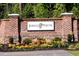 Welcoming Jordan Pointe community entrance with brick signage and colorful landscaping at 3574 Johnson Grant Dr, New Hill, NC 27562