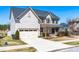 Charming two-story home with a two-car garage and well maintained landscaping in a friendly neighborhood at 3574 Johnson Grant Dr, New Hill, NC 27562