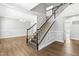 Grand foyer with wood floors and staircase to the upper level at 3574 Johnson Grant Dr, New Hill, NC 27562
