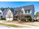 Charming two-story home with a well-maintained lawn, and inviting front porch, providing curb appeal at 3574 Johnson Grant Dr, New Hill, NC 27562