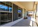 Cozy front porch with decorative columns, large windows, and a view of the neighborhood at 3574 Johnson Grant Dr, New Hill, NC 27562
